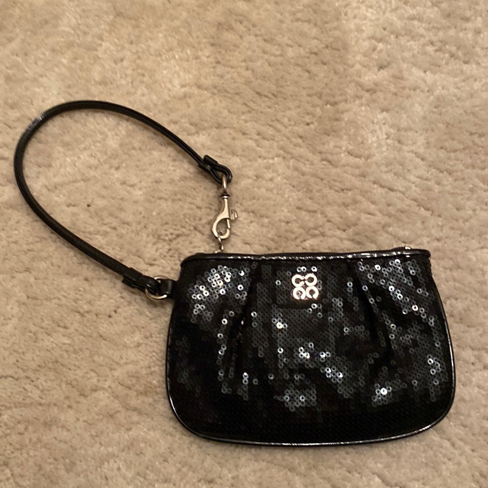 Coach sequin wristlet,wallet with buckle. Black with clean purple silky lining
